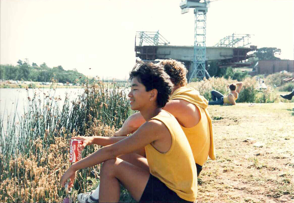 Members of senior rowing team sitting by the banks of the Barwon River, 1989