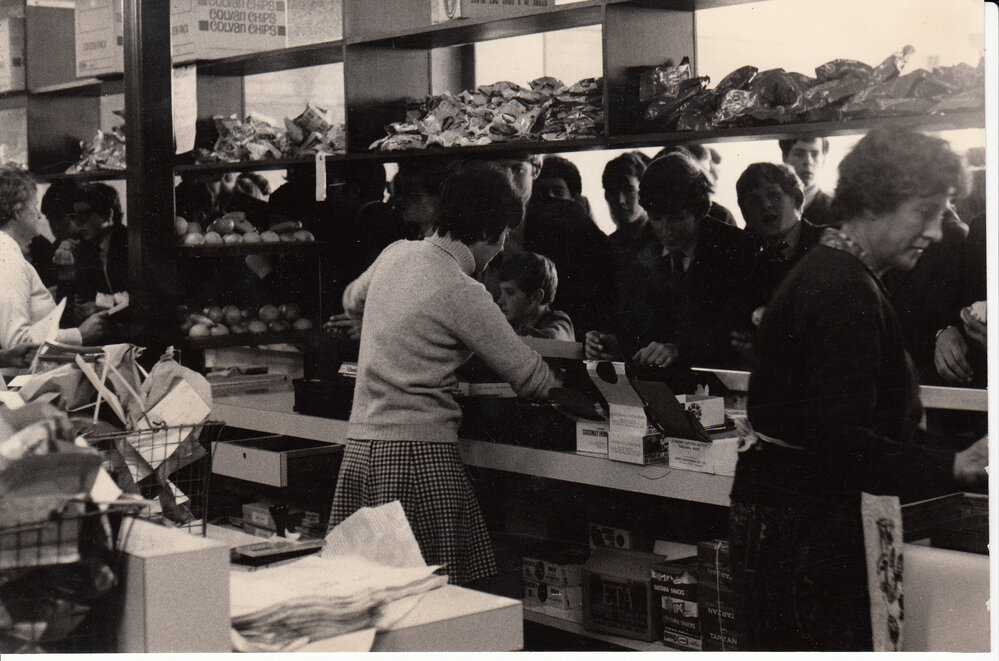 Rush hour at the tuck shop, 1960