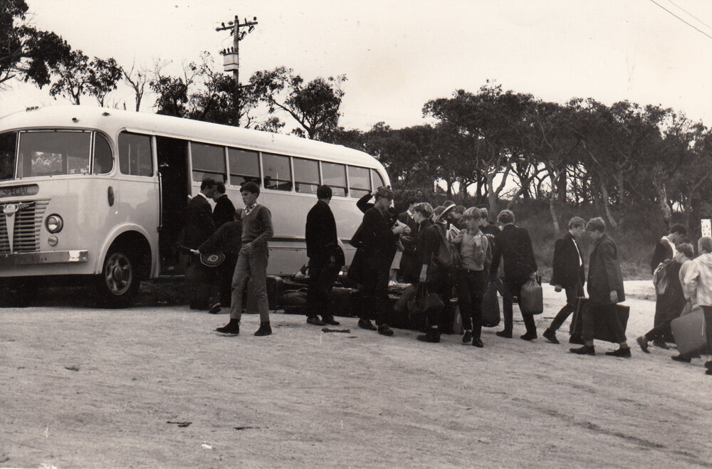 Students boarding bus, 1969