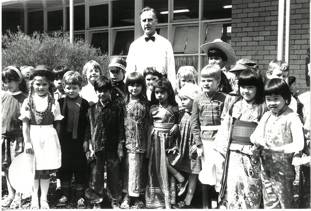 Don Brown with Junior School students in costume, 1980s