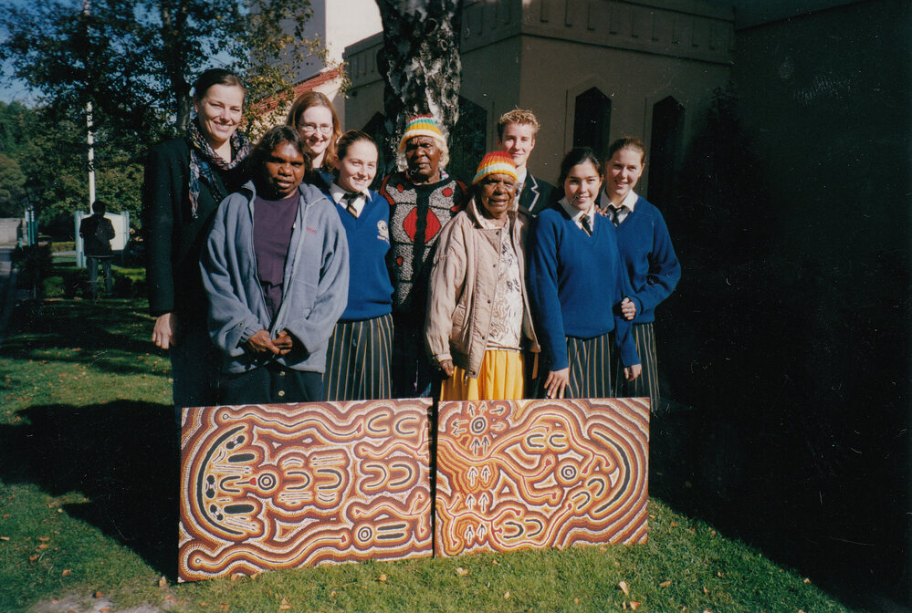 First Nation elders and students with painting that they produced together, 2000