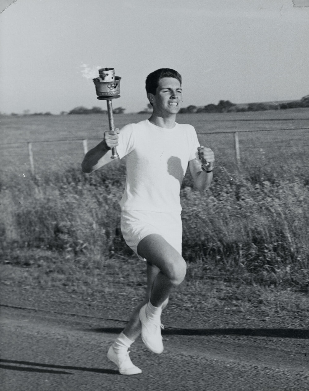Peter Whitehead carrying the Olympic torch, 1956