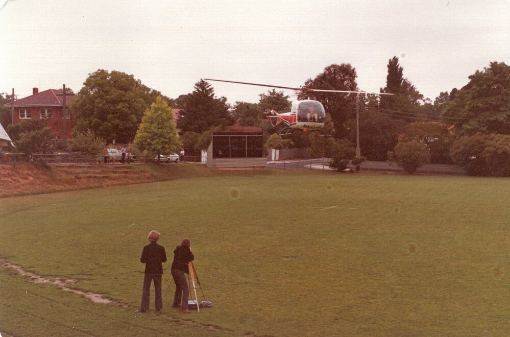 Rescue squad helicopter landing on the Sandell Oval, 1977