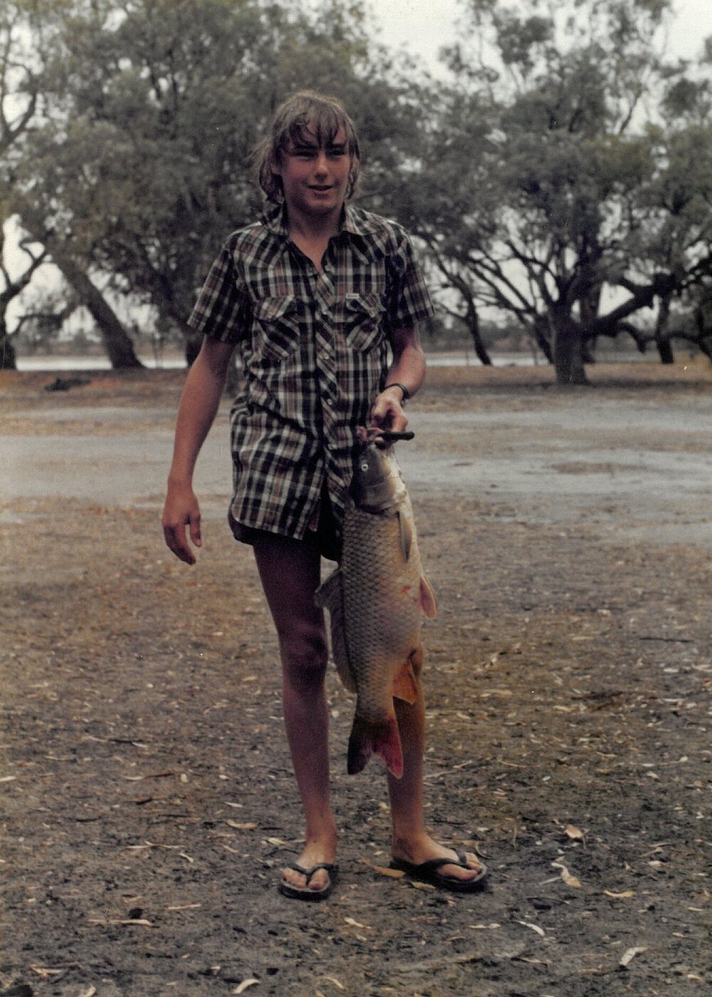 Greg Harding holding carp fish, 1978