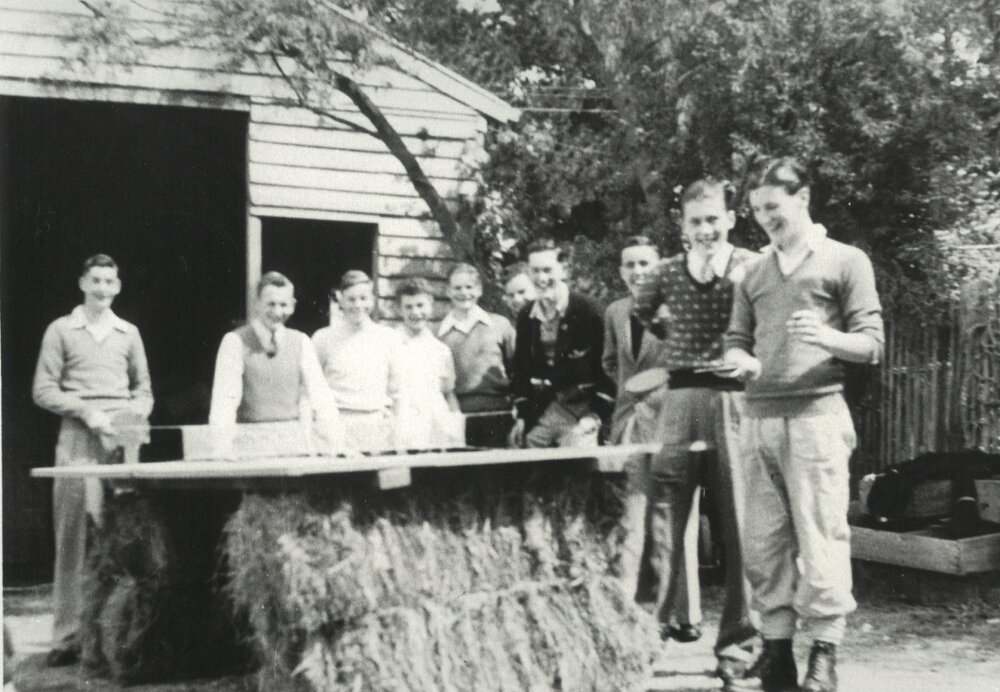 Makeshift table tennis table on hay bales, circa 1953