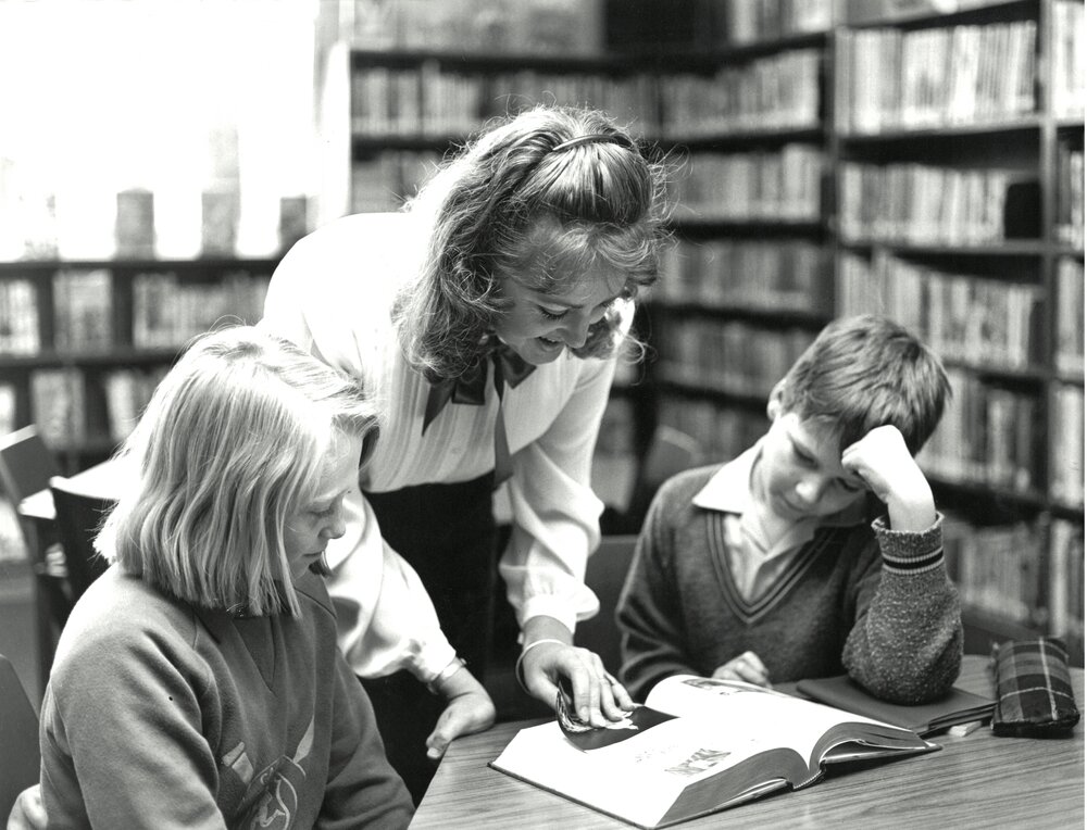 Mrs Bronwen Bennett, Junior School Librarian, with students, circa 1986