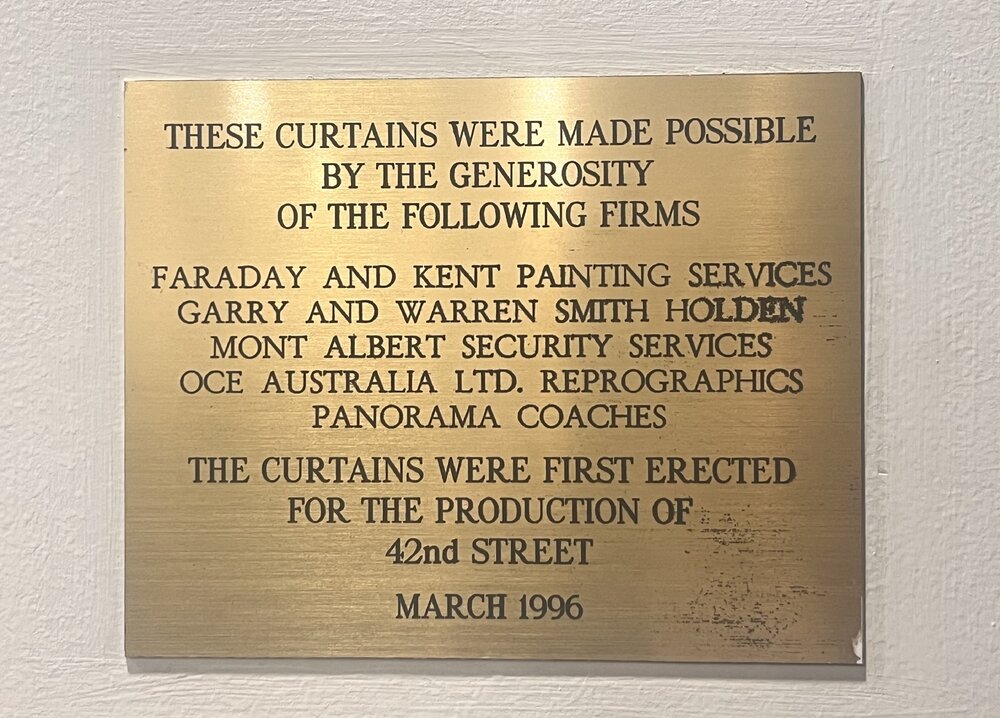 Memorial Great Hall theatre curtains plaque, 1996