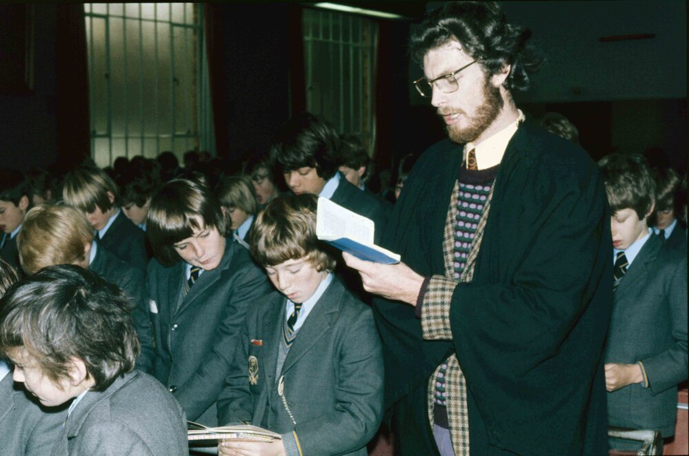 Teacher reading from the Carey prayer book in the MGH, 1974