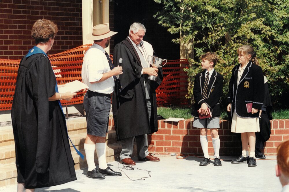 Mr Noel Voigt holding the Middle School cup, 1996