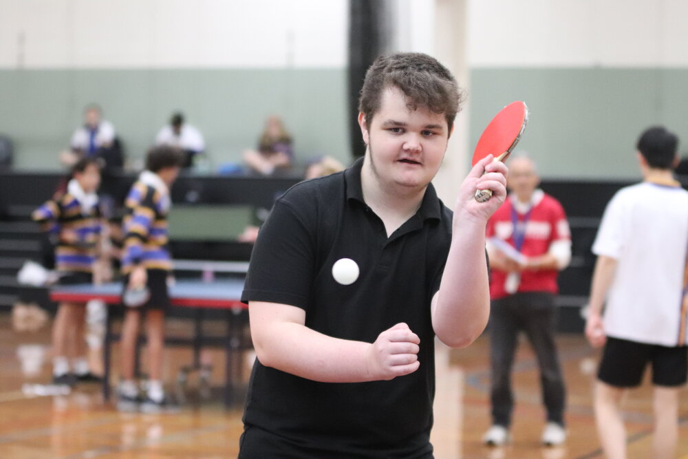 Tranter House member playing table tennis at Summer Sports Day, 2021