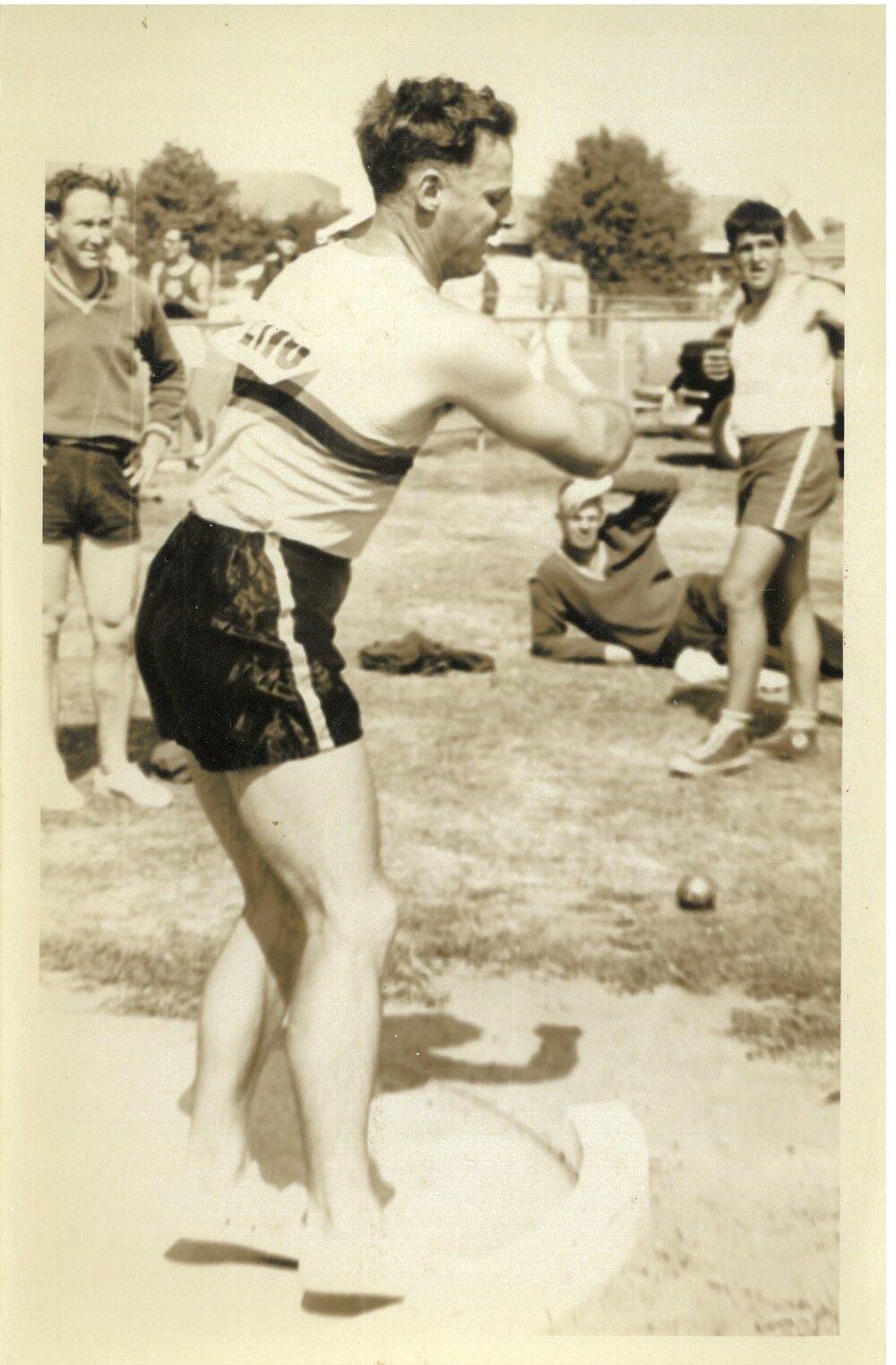Bruce Carfrae throwing shot put, 1960s