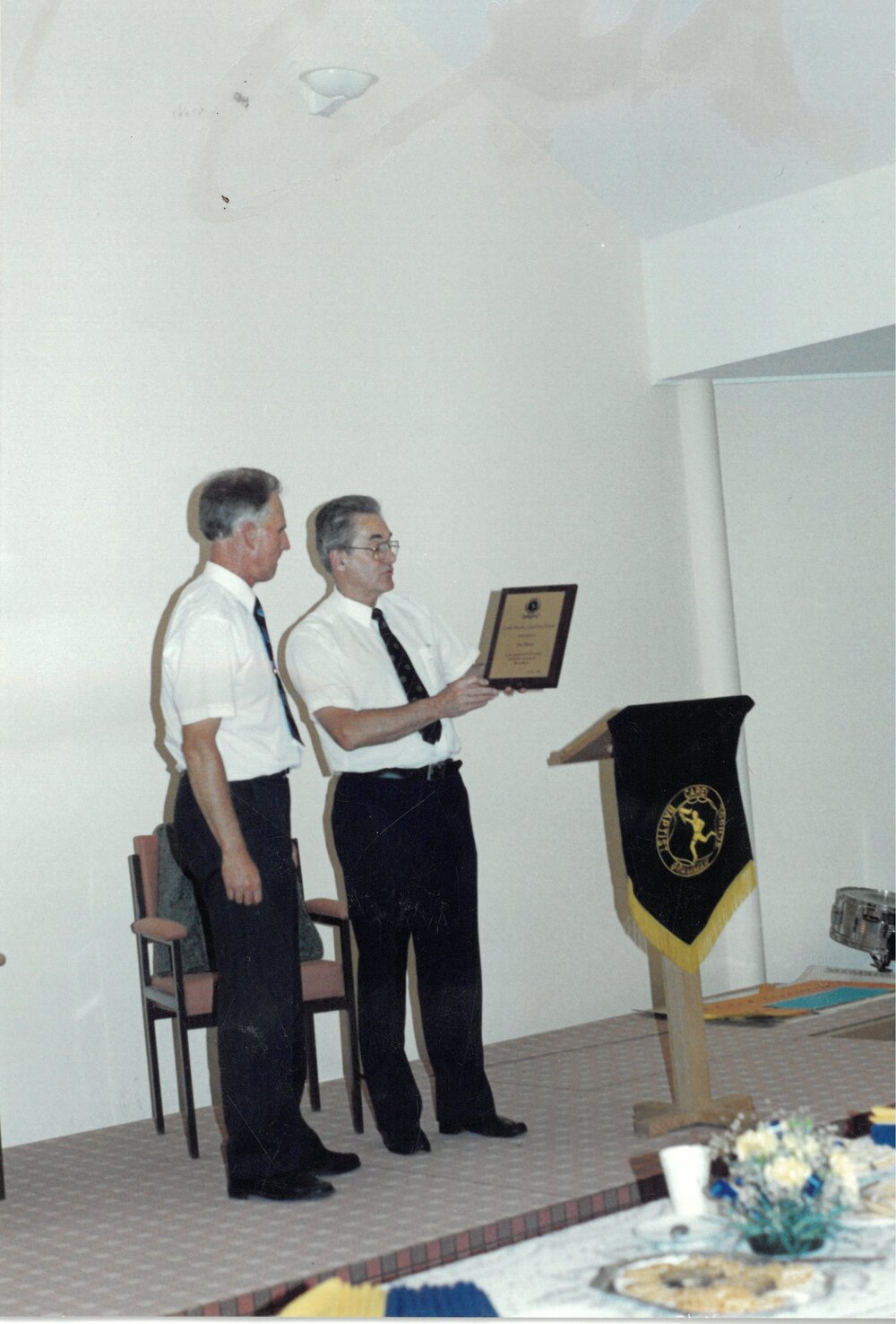 Rev. Peter Stockman presenting Mr Don Brown award recognising his 32 years dedicated service to the school, 1990