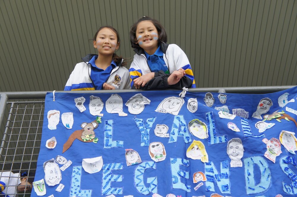 Lyall House members with 'Lyall Legends' banner, 2013