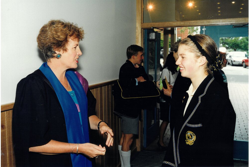 Reverend Jillian Stewart speaking with Middle School student, 1996