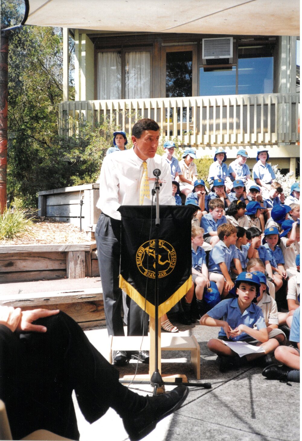 Mr Jon Abbott addresses students at the 10th anniversary assembly of the Donvale campus, 1999