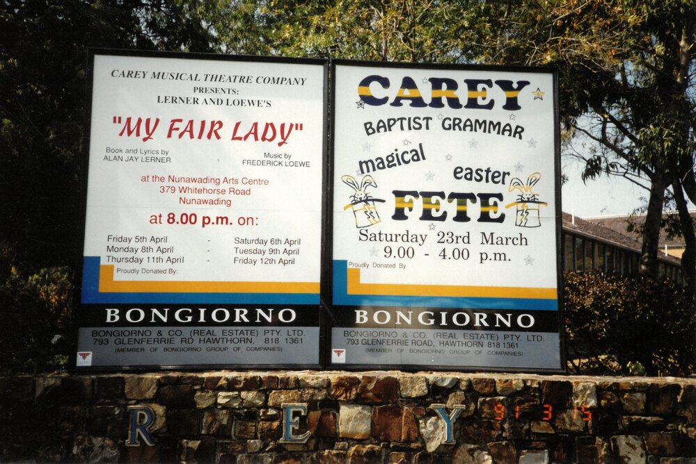 Boards advertising 'My Fair Lady' and Carey Magical Easter Fete, 1991