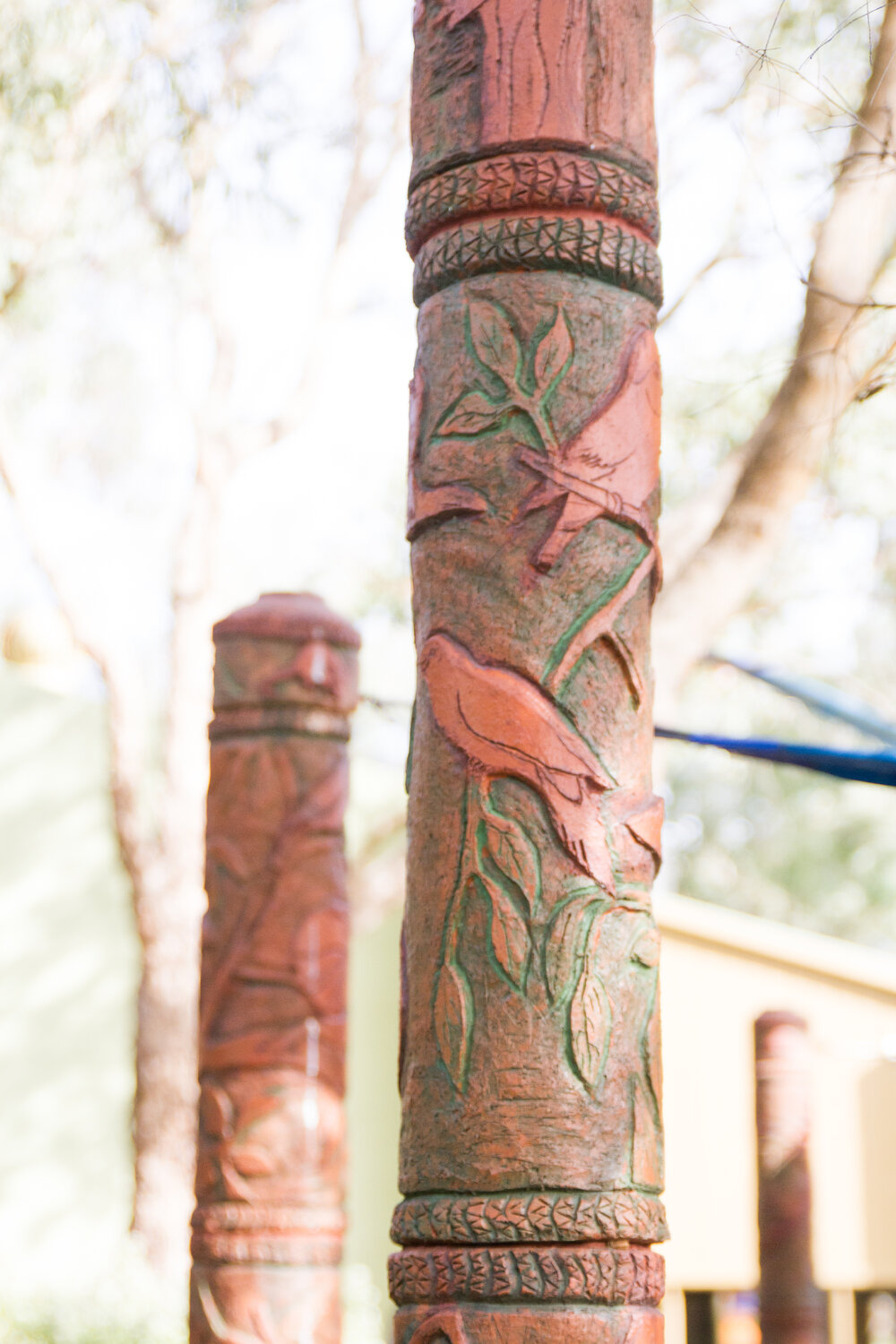 Totems created to camouflage the support posts of the amphitheatre shade sails, 2014