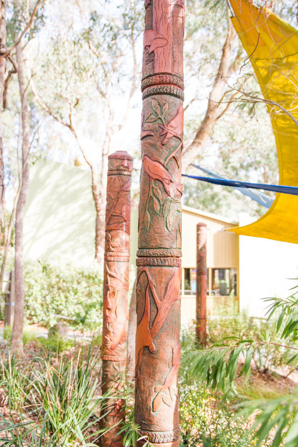 Totems created to camouflage the support posts of the amphitheatre shade sails, 2014