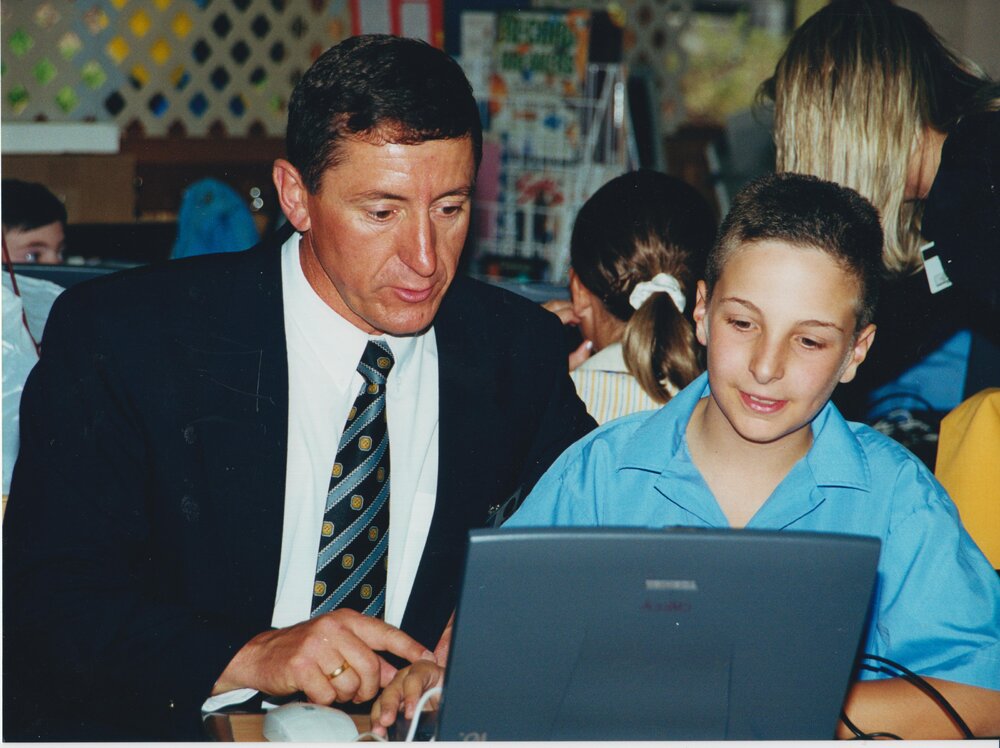 Jon Abbott and student with laptop, 2000s
