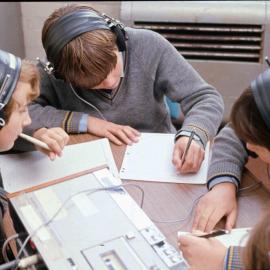 Students listening to audio with headphones, 1974