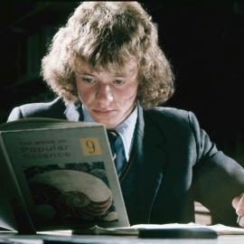 Form 9 student studying with science book, 1974