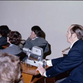 Senior boys watching film, 1974