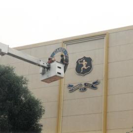 Placing the Carey logo and crest on the MGH, 1999