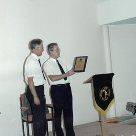 Rev. Peter Stockman presenting Mr Don Brown award recognising his 32 years dedicated service to the school, 1990