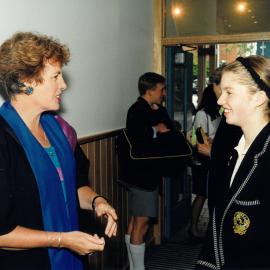 Reverend Jillian Stewart speaking with Middle School student, 1996