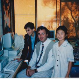 John Bonnyman at computer with students, 1998