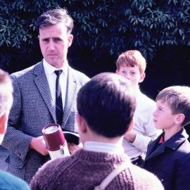Mr. Brown - Transport Officer - at Albury Station - getting groups into buses, 1969