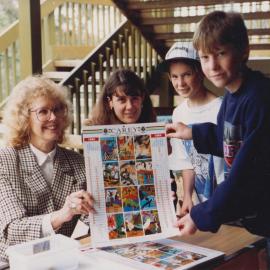 Wendy Weeks displaying the Donvale wall calendar, 1994