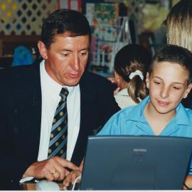 Jon Abbott and student with laptop, 2000s