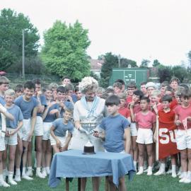 Mrs. Beau Rostron presents the cup to Steele House, 1965