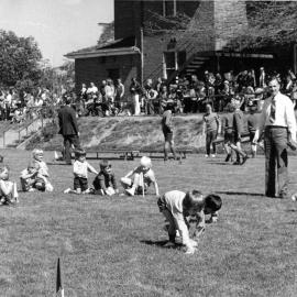 Don Brown observing Preparatory School sports on the Sandell Oval, 1970s