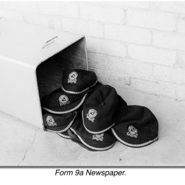 School caps next to rubbish bin, 1969