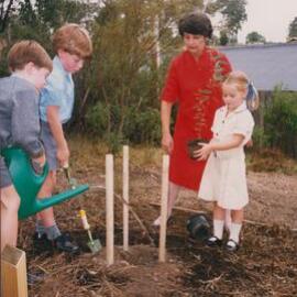 Shirley Allen and students tree planting, 1990s