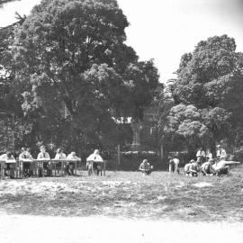 Junior School students take their studies and desks outdoors, 1960s