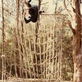 Climbing commando nets at 8E Buxton Camp, 1978