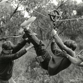 Students using flying-fox as part of course in bushcraft, 1967