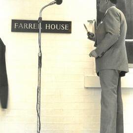 Dr Keith Farrer cuts the ribbon at opening of Farrer House, 1980
