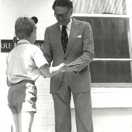 Nicholas Nairn presents Dr Farrer a framed sketch of Farrer House, 1980