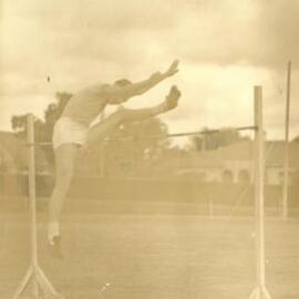 Norman Wilcox clearing the high jump, 1930s