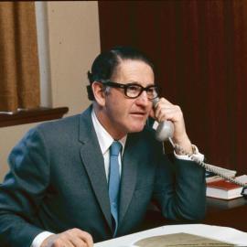 Keith Farrer on telephone, 1974