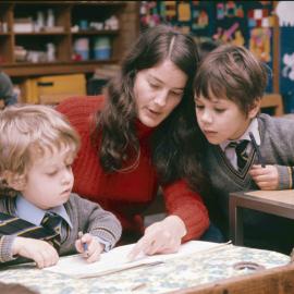 Female teacher with Preparatory School boys, 1974