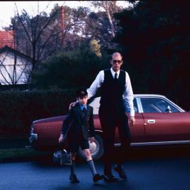 Parent dropping junior boy at school, 1974
