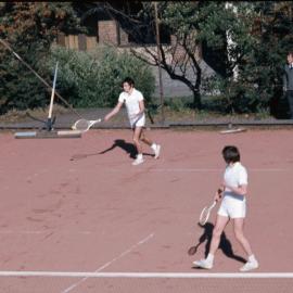 Students playing tennis, 1974