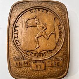 Wooden carving of Carey crest, 1930s